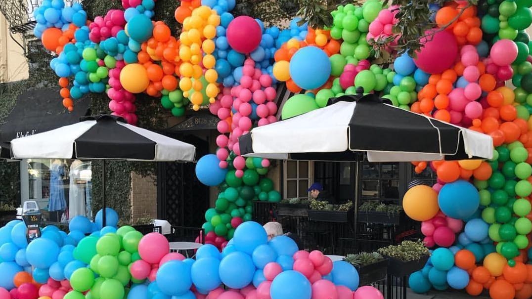 colorful balloons in the street for paperworld middle east